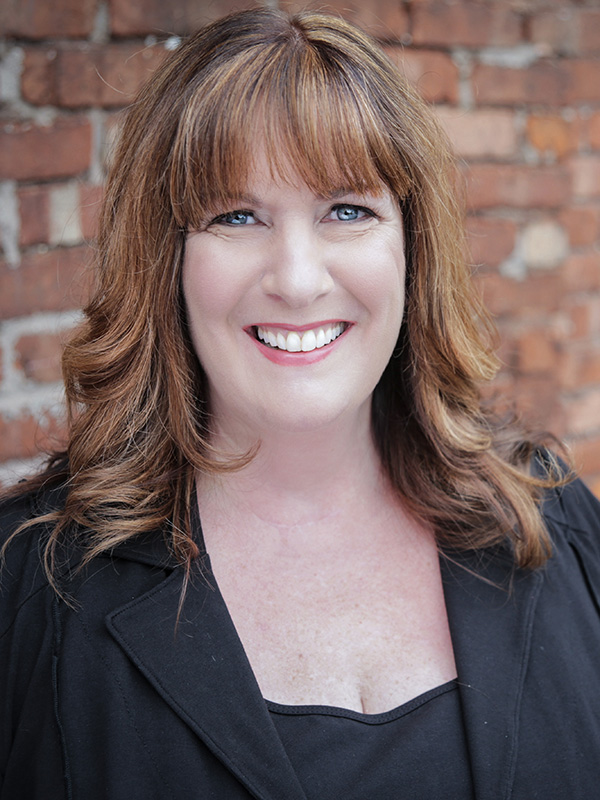 Host Profile Photo: This image is a professional headshot of Becoming Referable Host Julie Littlechild
